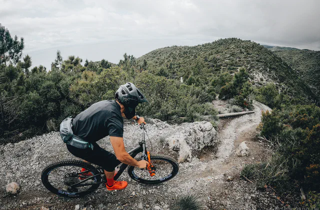 Mountain biker on a rocky trail in Finale Ligure